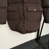 2026 autumn and winter large pocket waist cinched long sleeved hooded mid length cotton jacket for girls