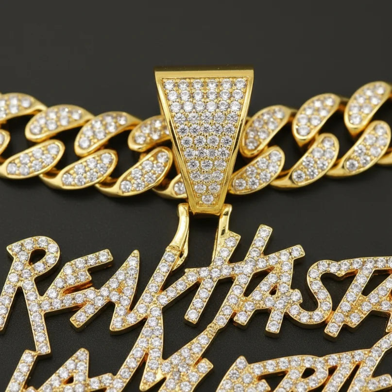 Hip-hop Cuban link necklace — "REAL HASTA LA MUERTE" pendant; gold and silver chains for a rapper-style look.