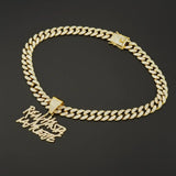 Hip-hop Cuban link necklace — "REAL HASTA LA MUERTE" pendant; gold and silver chains for a rapper-style look.
