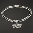 Hip-hop Cuban link necklace — "REAL HASTA LA MUERTE" pendant; gold and silver chains for a rapper-style look.