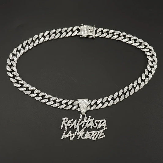 Hip-hop Cuban link necklace — "REAL HASTA LA MUERTE" pendant; gold and silver chains for a rapper-style look.