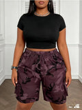 Plus size women's camouflage drawstring cargo shorts; high waist loose big pocket knee-length shorts; hot girl street style knee-length shorts